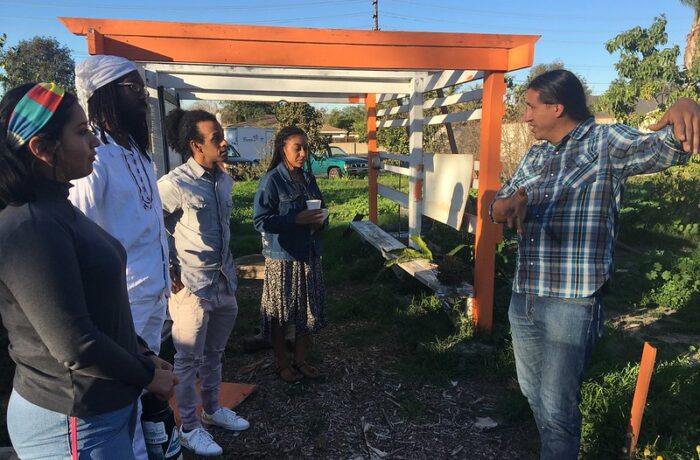 Man leads an outdoor workshop at UC Irvine