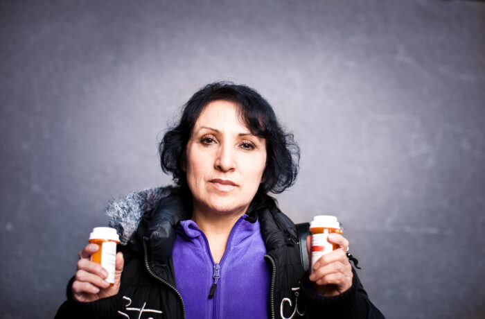 Person Holding Two prescription Bottles
