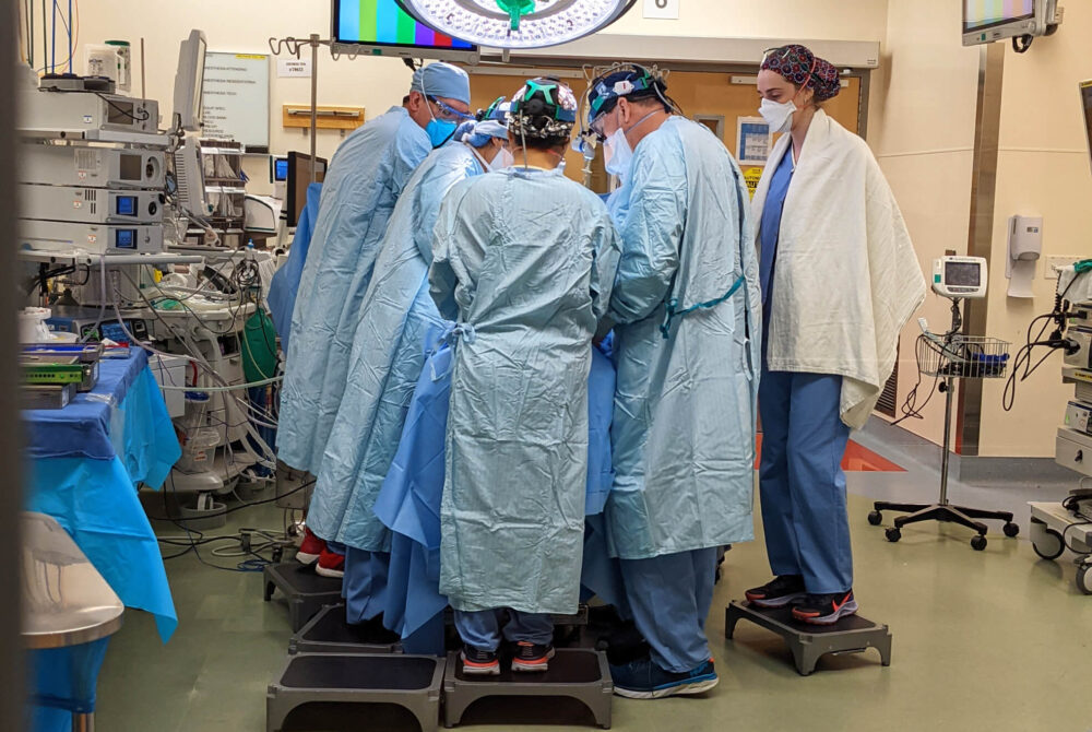 Doctors in operation room during reusable surgical gown trial
