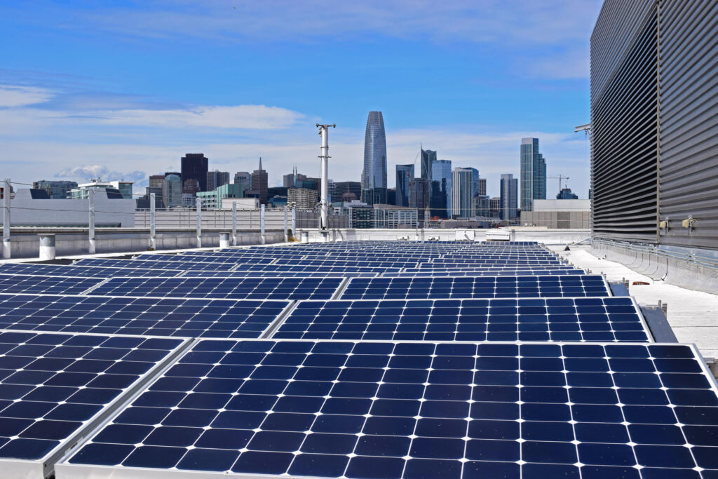 View of solar panels at Mission Bay with the cityscape in the background