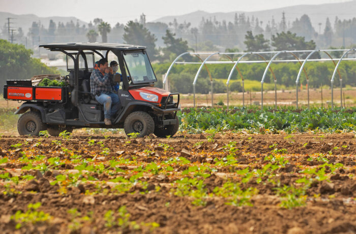 Students in utility vehicle in R'Garden