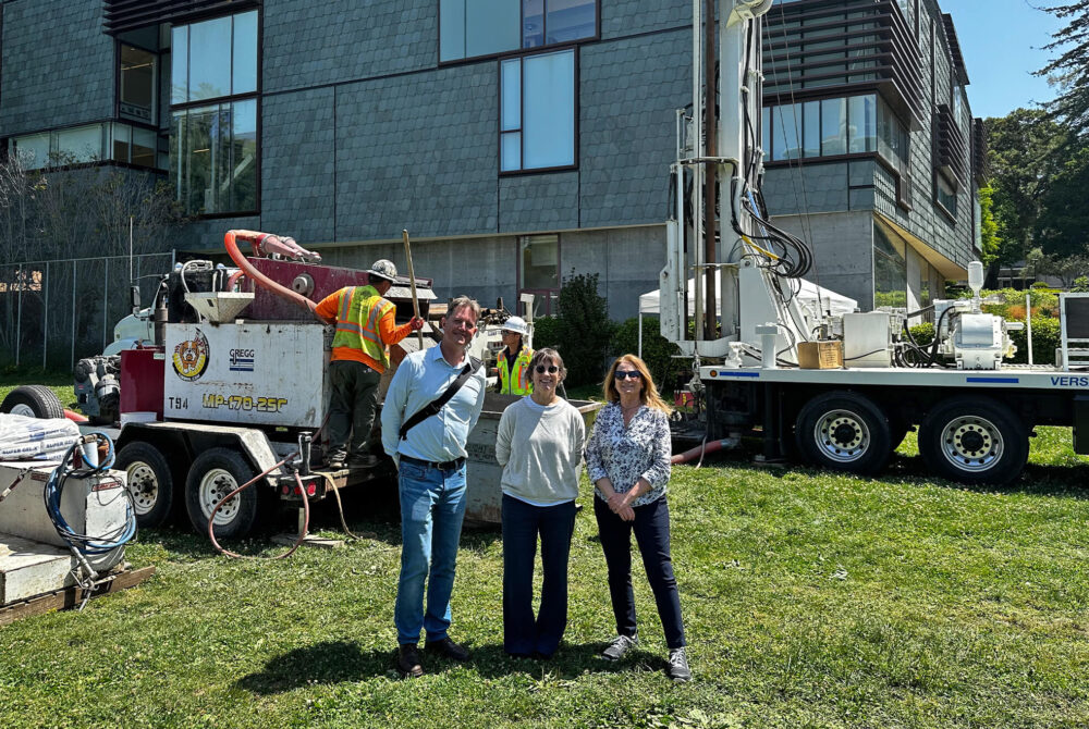 Staff at test bore hole for clean energy campus