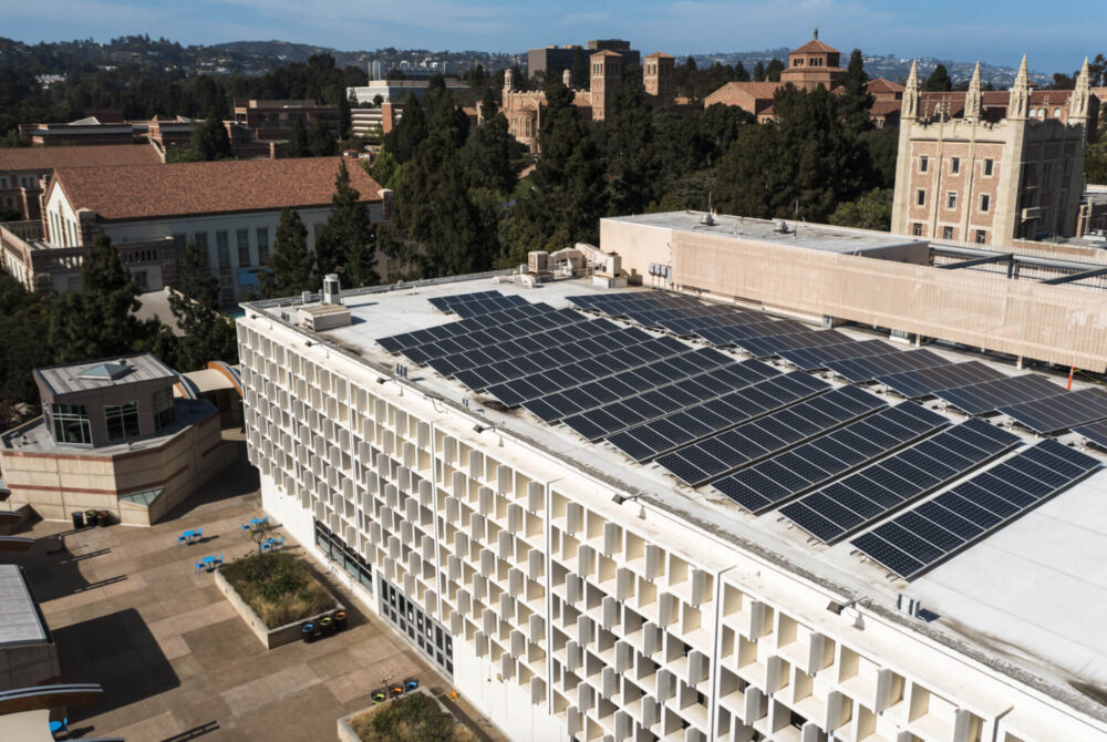 Big, white building with tons of solar panels on roof