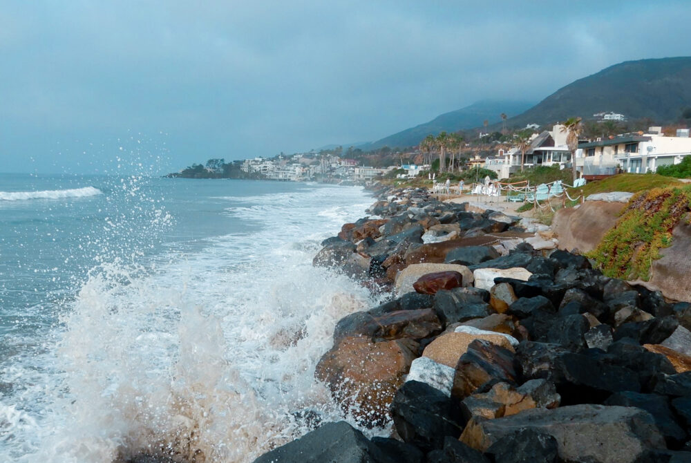 California Coasts. Water Splashing on Rocks