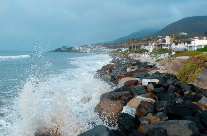 California Coasts. Water Splashing on Rocks