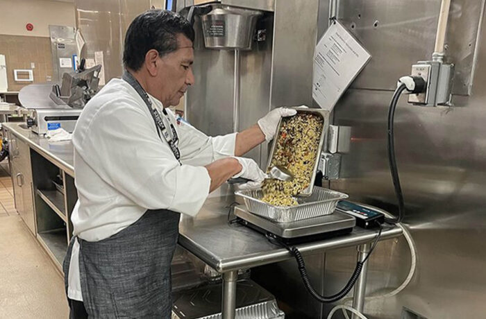 Cafeteria Worker Handling Food