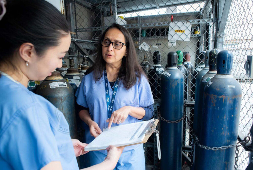 Nurses Using Checklist Next To Nitrous Oxide