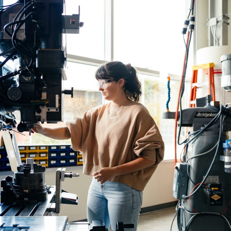 Person in a laboratory operating equipment