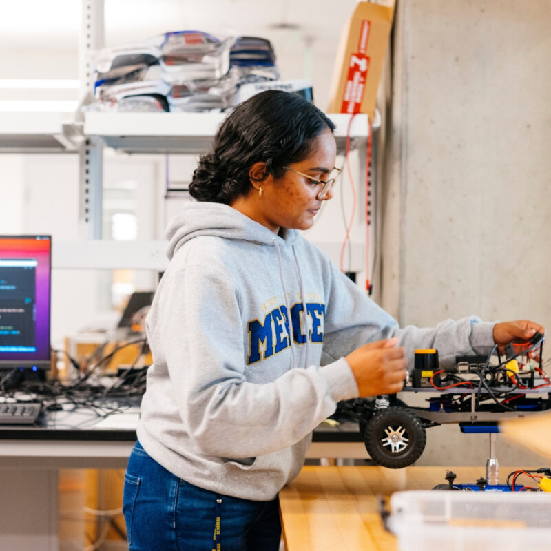 A student works on a small electric device